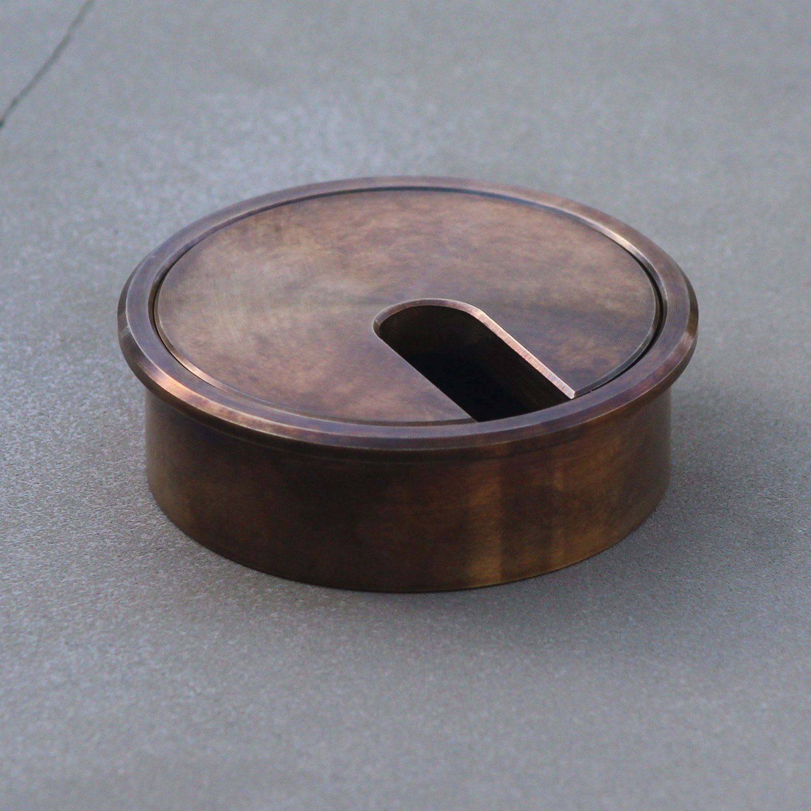 Aged brass 60mm cable entry grommet — antique brass patina product photo for search